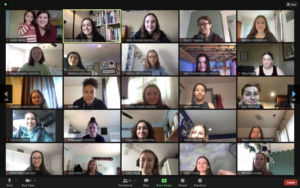 Zoom screenshot of 25 CommuniCare participants smiling into the camera.
